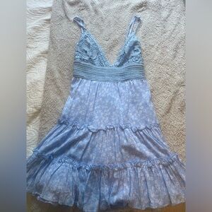 Women’s blue dress with adjustable straps and tie on back